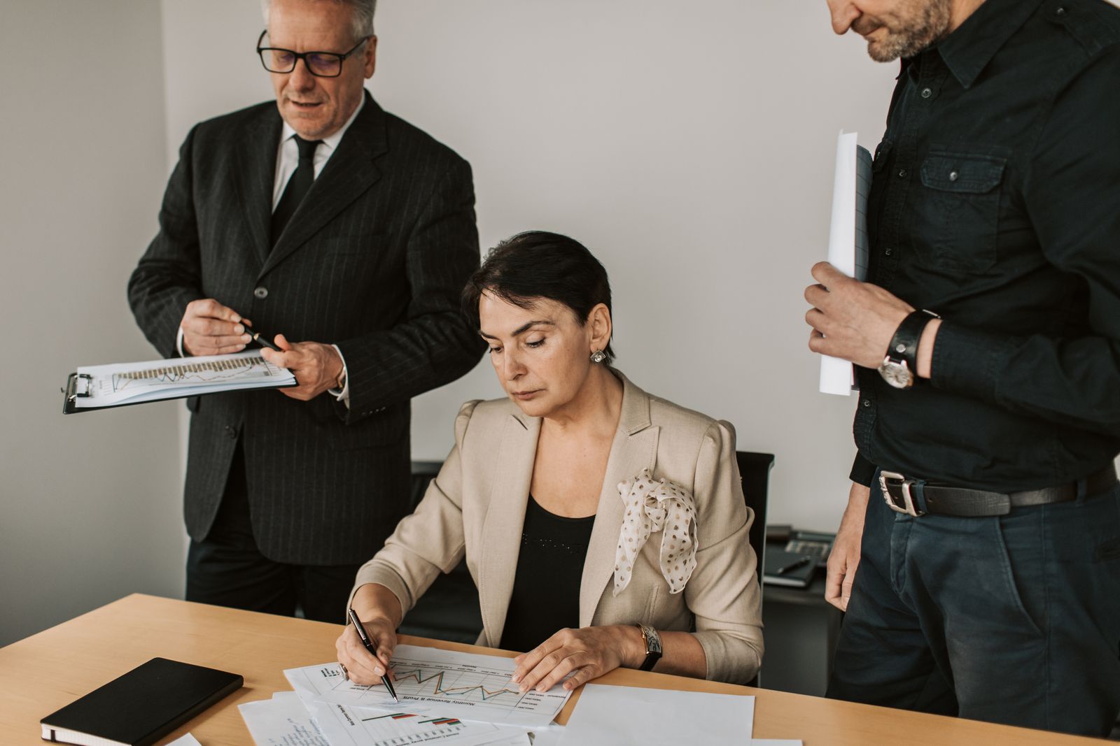 Financial services professionals reviewing documents in a meeting