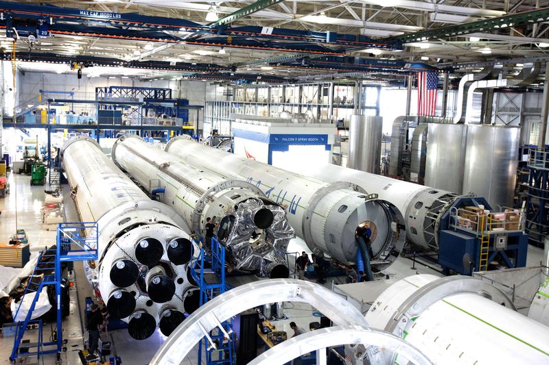 A spacecraft assembly line inside an aerospace factory