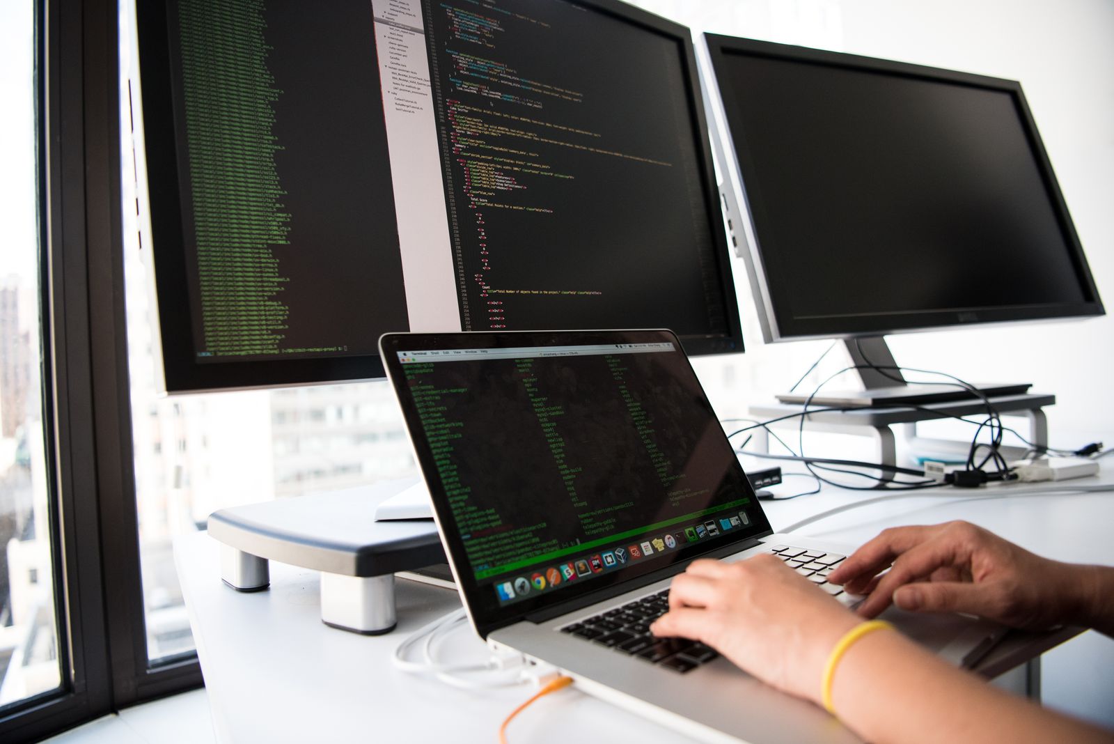 Software engineers collaborating at their workstations